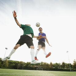 Soccer players heading soccer ball - BLEF00119