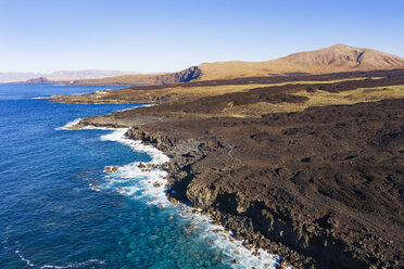 Spain, Canary Islands, Lanzarote, Tinajo, Los Volcanos nature park, aerial view over rocky coast - SIEF08592