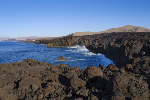 Spain, Canary Islands, Lanzarote, Tinajo, Los Volcanos nature park, view over rocky coast stock photo