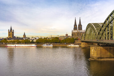 Germany, Cologne, Hohenzollern Bridge and Cologne Cathedral in the morning - TAMF01318