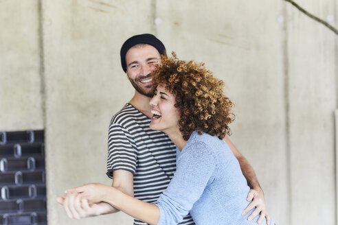 Laughing playful couple dancing - FMKF05618