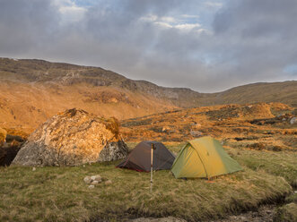 Great Britain, Scotland, Northwest Highlands, Ben More Assynt, mountainscape and tents in morning light - HUSF00041