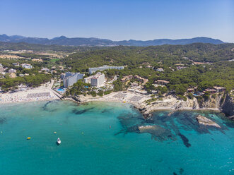 Spain, Majorca, Costa de la Calma, aerial view over Peguera with hotels and beaches - AMF06936