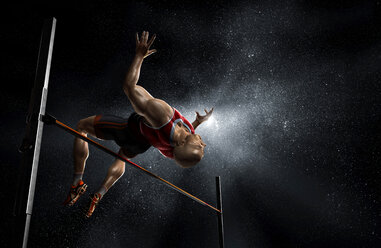 Male track and field athlete high jumping - CAIF23285