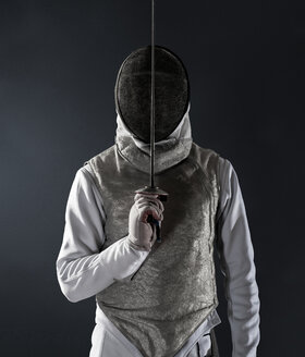 Portrait man in fencing uniform and mask - CAIF23288