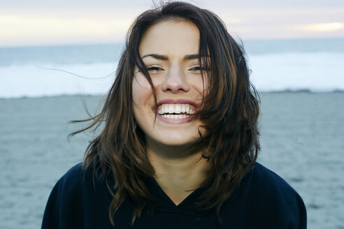 Portrait of laughing Caucasian woman at beach - BLEF00261