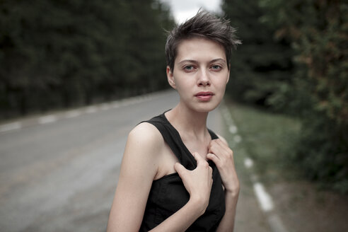 Serious Caucasian woman standing in road - BLEF00424