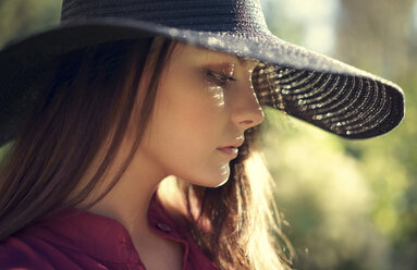 Close up of pensive Caucasian teenage girl wearing hat - BLEF00481