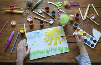 Hands of Caucasian boy painting with watercolors - BLEF00482