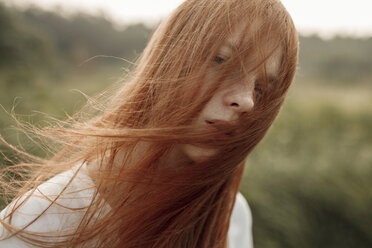 Close up of wind blowing hair of Caucasian woman - BLEF00562