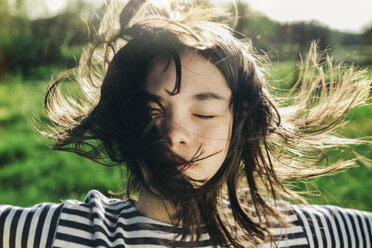 Wind blowing hair of Caucasian teenage girl - BLEF00754