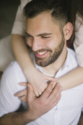 Caucasian woman hugging smiling man - BLEF00803