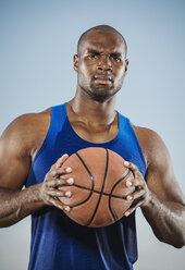 Confident black man holding basketball - BLEF01006