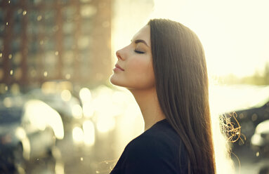 Profile of Caucasian woman outdoors with eyes closed - BLEF01160