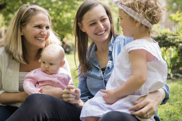 Caucasian mothers and daughters smiling in park - BLEF01226