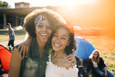 Portrait of smiling friends enjoying at music festival during summer - MASF12219