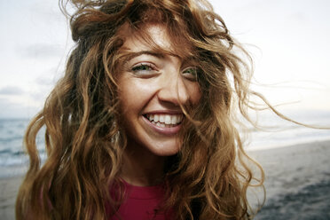 Wind blowing hair of Caucasian woman on beach - BLEF01326