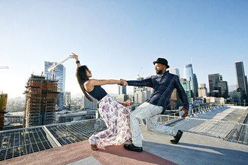 Couple dancing on urban rooftop - BLEF01333