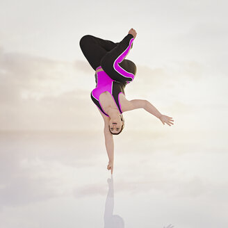 Woman balancing upside-down on fingertip - BLEF01355