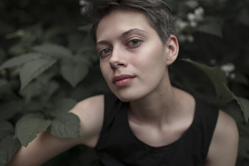 Caucasian woman posing in leaves - BLEF01640