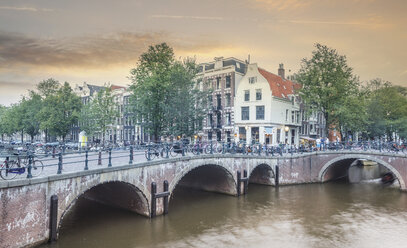 Bicycles on bridge over urban river - BLEF01662