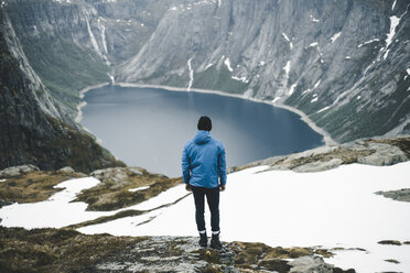 Caucasian man admiring scenic view of mountain lake - BLEF01674