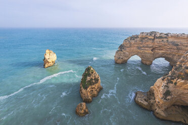 Portugal, Algarve, Lagoa, Praia da Marinha, rocky coastline and heart-shaped rock in the sea - MMAF00915