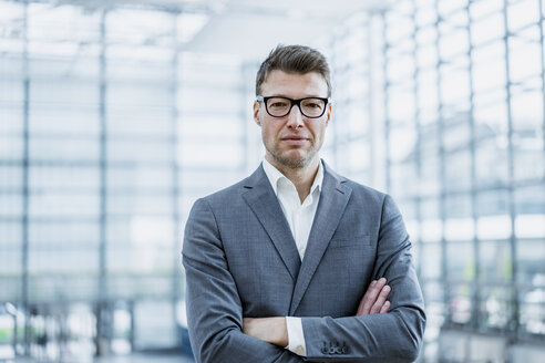 Portrait of confident businessman with glasses - DIGF06867