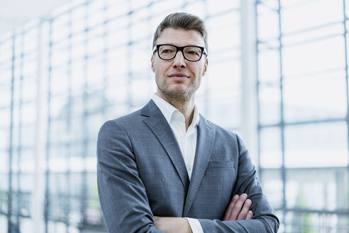 Portrait of confident businessman with glasses - DIGF06868