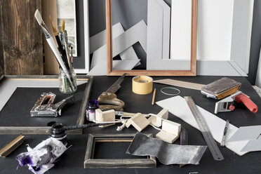 Picture frame and tools on tables - BLEF02014