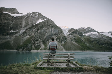 Caucasian man admiring scenic view of mountain lake - BLEF02028