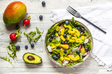 Bowl of rocket salad with mango, avocado, red radishes and blueberries - SARF04246