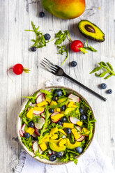 Bowl of rocket salad with mango, avocado, red radishes and blueberries - SARF04248