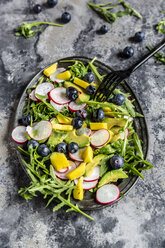 Platter of rocket salad with mango, avocado, red radishes and blueberries - SARF04251