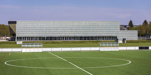 Germany, Tuebingen, modern Multi-Purpose Hall Paul Horn-Arena with solar panels and football pitch - WDF05257