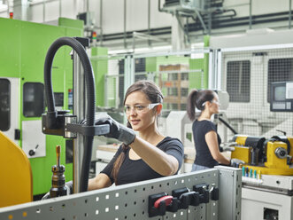 Two women working on machines - CVF01144