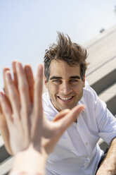 Portrait of happy man touching hand of a woman - AFVF02874