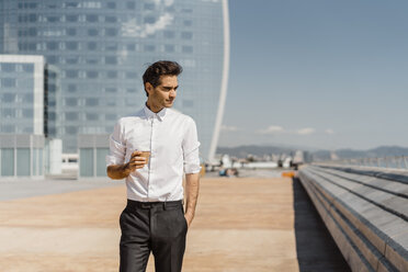 Businessman with takeaway coffee in the city - AFVF02915