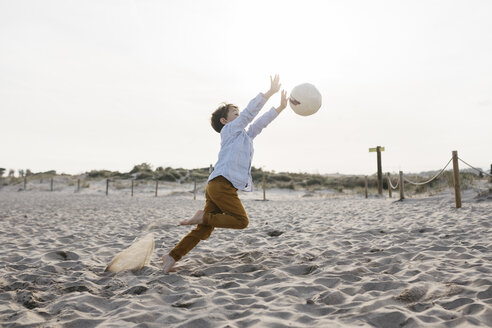 Little boy playing soccer on the beach - JRFF03235