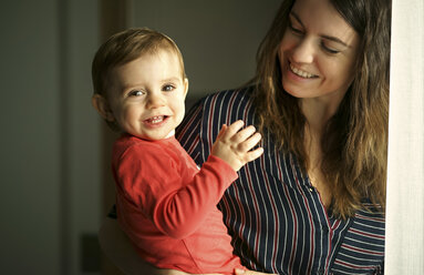 Caucasian mother holding smiling baby son - BLEF02138