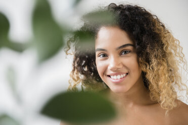 Close up of Mixed Race woman with bare shoulders stock photo