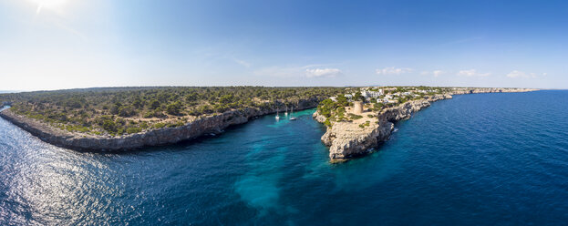 Spain, Balearic Islands, Mallorca, Llucmajor, Aerial view of bay of Cala Pi and Torre de Cala Pi - AMF06979