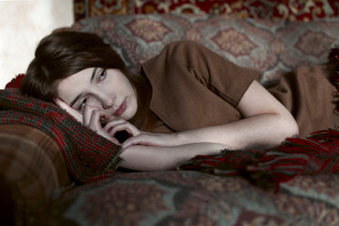 Caucasian woman laying on sofa - BLEF02609