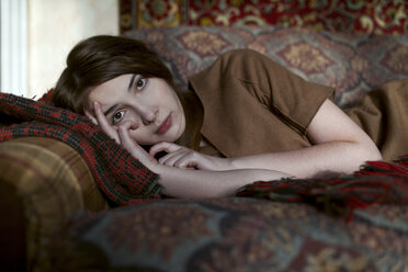 Caucasian woman laying on sofa - BLEF02610