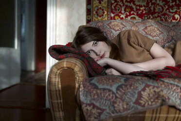 Caucasian woman laying on sofa - BLEF02611