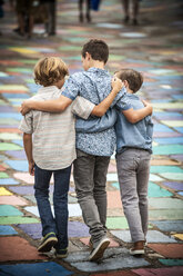 Brothers hugging and walking - BLEF02800