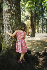 Caucasian girl walking on tree roots - BLEF02868