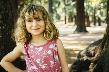 Portrait of smiling Caucasian girl near trees - BLEF02869