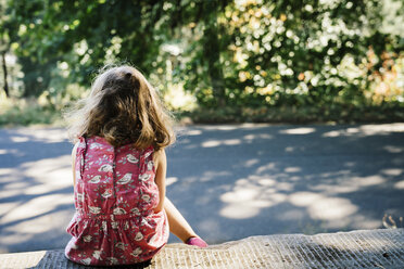 Caucasian girl sitting on curb - BLEF02875