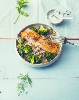 Fried salmon with buckwheat pilaf and broccoli in a bowl - PPXF00193